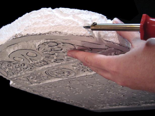 To create deep cuts or cracks, hold the tool to the Styrofoam surface a bit longer, dragging the line out. For more accurate design work, you can cut the lines with an X-acto knife.