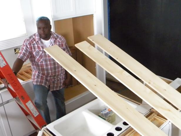 Rip the bottom to width, which, when attached, will be flush with both outside corners. Pre-cut the side and bottom wood to the span lengths using a circular saw or chop saw and bring the three long pieces into the room for installation.