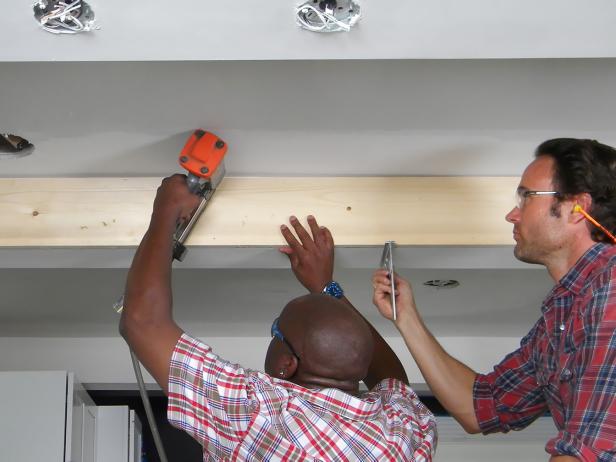 An assistant will be very helpful in holding and aligning the girder wrap pieces in place while they are attached.
