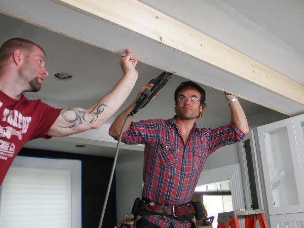 Attach the second side cut, using the nail gun and an assistant for alignment.