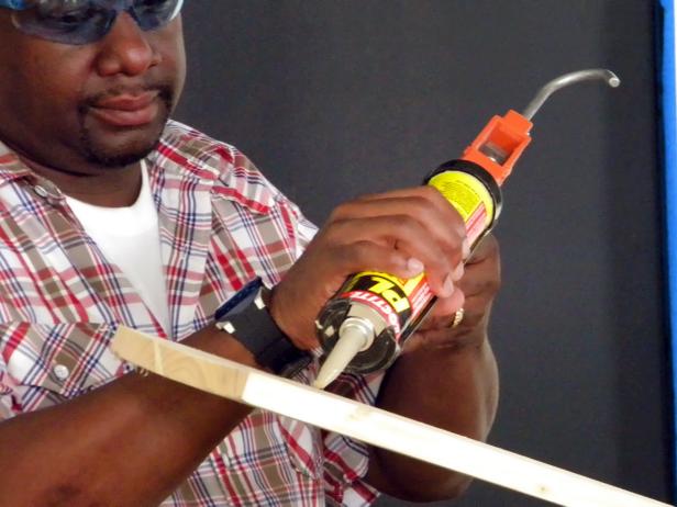 Apply heavy-duty construction adhesive to the pre-measured bottom cut.
