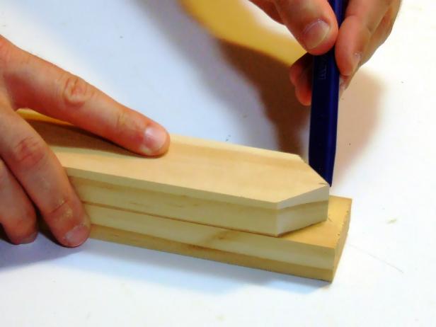 Cut the first picket, then trace the mitered end (45 degrees) on the 1x2s. Create 11 pickets total.