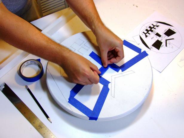 Mark the positions of the features using a pencil and apply painter's tape to the edges of the features.