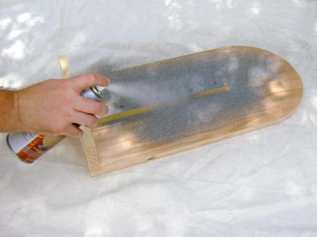 Apply the desired finish. Allow to dry. Use black paint to add details to the tombstone