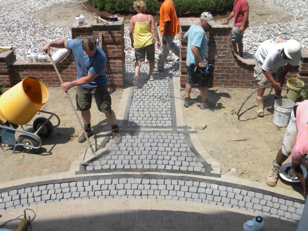 Once the stones are set in place, sweep the cobblestones clear so that there won't be any dirt in your epoxy.