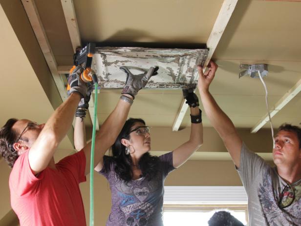 Line up the first panel along the center of two furring strips. A second hand is always helpful. Use a finish nailer with 2” finish nails to secure the ceiling panel to the furring strip.