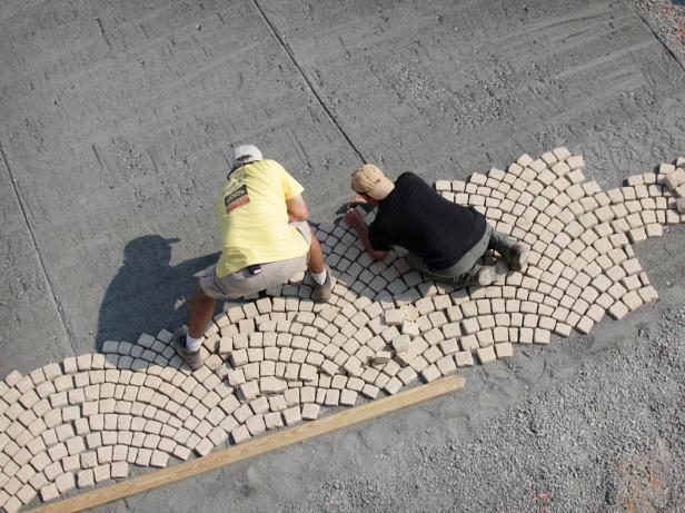 The sheets link together, providing a continuous application over the prescribed area. Once a sheet of stone is laid down, it may be walked on gently.