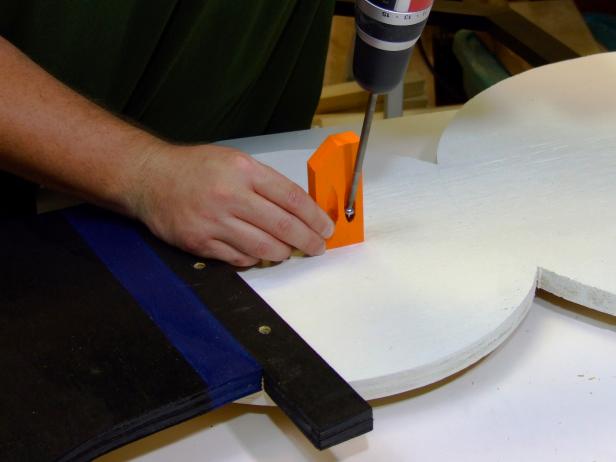 Paint the nose orange and attach to the top circle (head) of the body using 1-1/4-inch pocket-hole screws and no glue.