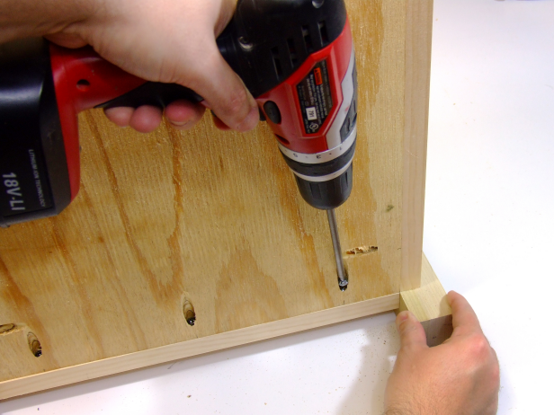 Position the bottom flush with the bottom rails and attach using glue and 1-1/4-inch pocket-hole screws (Image 6).