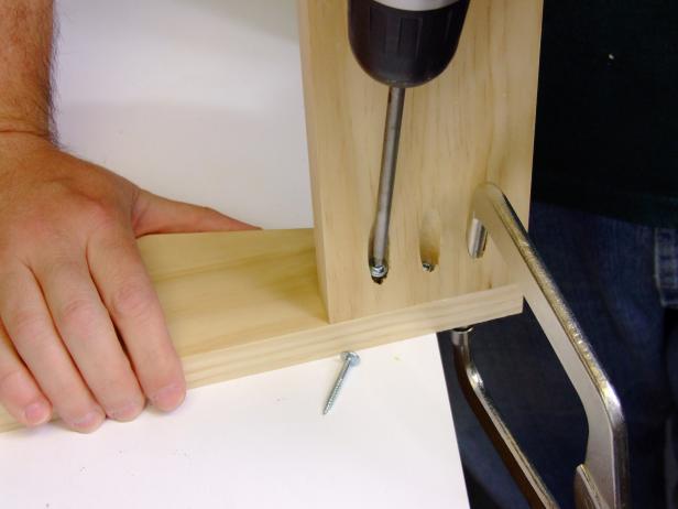 Drill three pocket holes on each end of one face of the headboard rail and attach using pocket-hole screws.