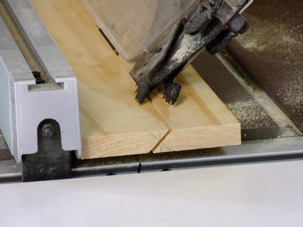 Set the saw blade on your table saw at 45 degrees, then set the fence on your table saw so that the 45-degree mark lines up with the saw blade. Rip the 1x6 to create the headboard cleat and wall cleat.