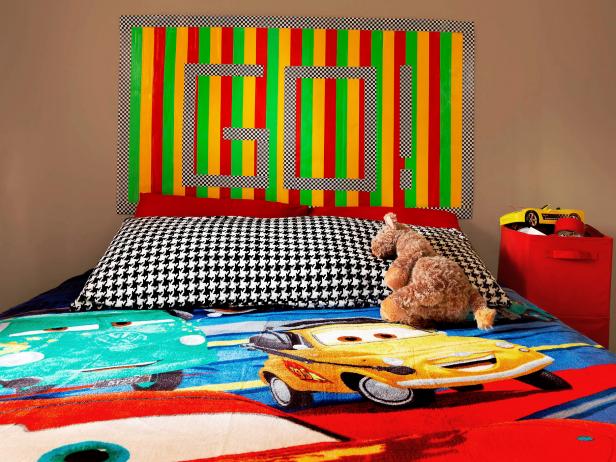 Colorful duct tape is wrapped around a big piece of cardboard to make this racy kids' headboard. This is an inexpensive and easy project to make with your kids. No power tools are required, and kids can use their creativity to the fullest.