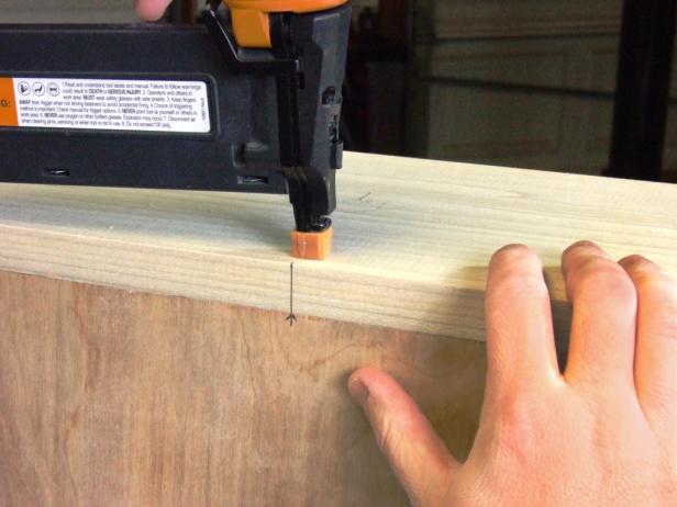 Position the top centered on the end of the assembly nearest the main shelf and flush with the back edge of the back and attach using glue and 1-1/2-inch brads.