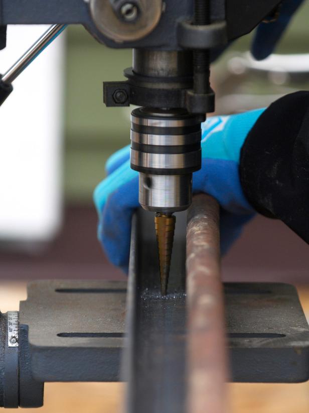 After properly measuring and marking the iron, drill the marked holes in the angle iron to 1/2".
