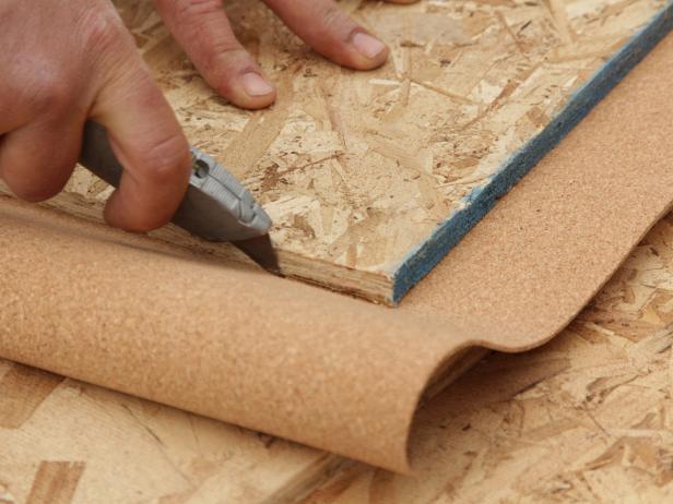 Next staple the perimeter of the cork to secure. Make sure the staples are within 1/2” of the edge of the board. Flip the sheathing over (cork side down) and trim the excess with a utility knife.