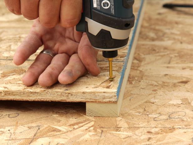 Attach the trim to the sheathing using wood screws 1/4" longer than the sheathing. Drive the screws in from the back of the sheathing into the trim.