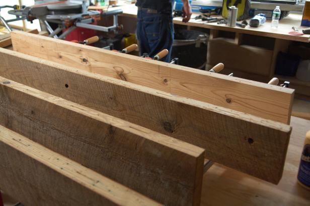 After all slots are cut, stand each board on end and coat the edge of jointed side with wood glue.
