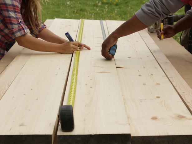 Lay the four best planks out on a flat surface and arrange them in final position. With a pencil and working across two boards at a time, make a mark at every 8" point along the seam of two boards.