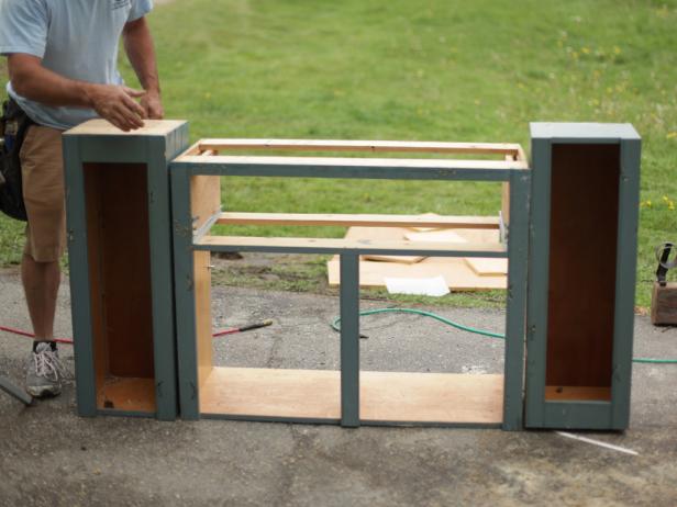 If cabinets are different heights, align them at the top. If necessary, infill the bottoms of any short cabinets with toe kicks made from claimed wood.
