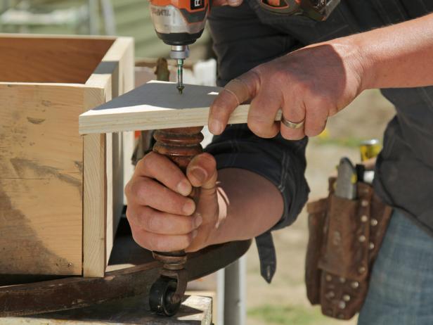 Screw table legs into the four gussets.