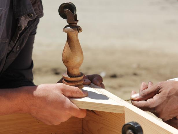 Screw legs into the four gussets. For table shown, the top was wood glued to the top of the leg; a 3" #10 wood screw was driven down through the gusset into the leg.