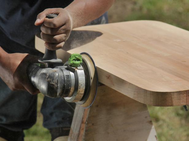 Smooth the perimeter of material with an orbital sander, removing only blade marks and high spots, and take care not to reshape the piece.