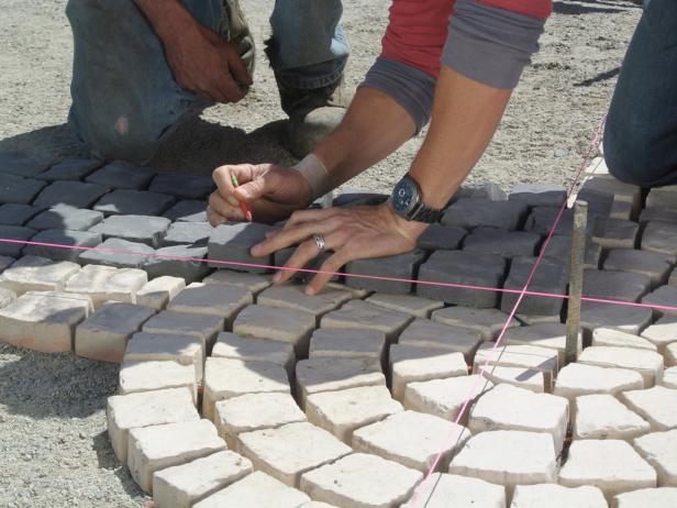 Overlap the charcoal stones to mark the cuts.