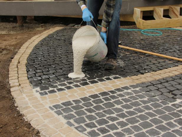Make sure you pour the sand/epoxy mixture to the edges of the stone area.