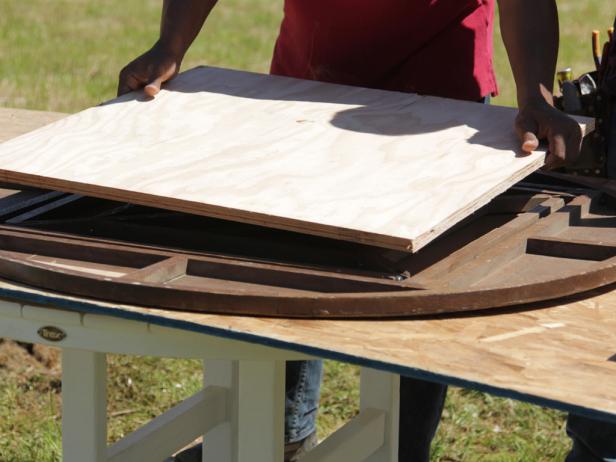 With the antique top upside down, determine the best place to mount the new base skirt. Look for underlying structure with enough material to drive wood screws through.