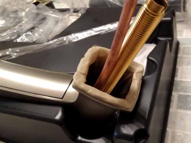 CI-Dylan-Eastman_faucet-replacement-putty-on-edges-of_new-faucet_h CI-Dylan-Eastman_faucet-replacement-putty-on-edges-of_new-faucet_h