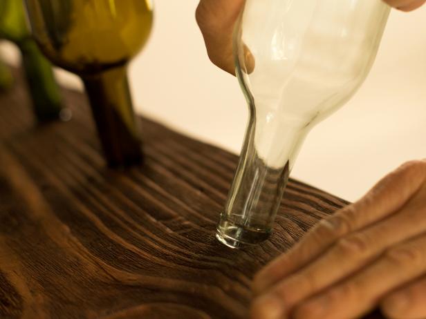 Orginal-Chandelier-Made-From-Wine-Bottles_fitting-bottles-in-plank_4x3 Orginal-Chandelier-Made-From-Wine-Bottles_fitting-bottles-in-plank_4x3