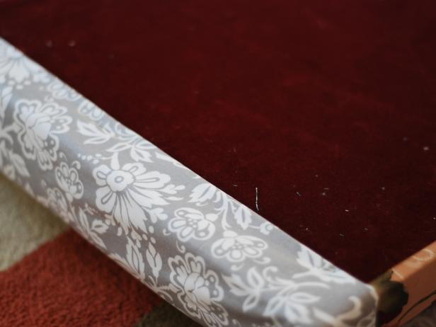 CI-Kara-Hill_Recovered-ottoman-top-on-stapling-fabric-onto-top-step2_h CI-Kara-Hill_Recovered-ottoman-top-on-stapling-fabric-onto-top-step2_h