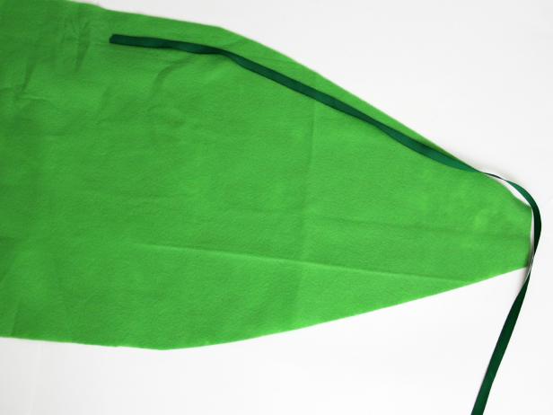 Attach ribbon along edge of leaf fabric.