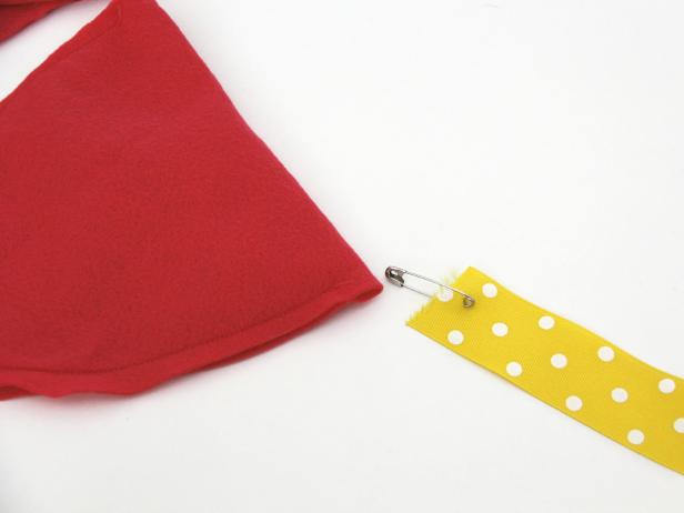 Sew edges of petals and string each petal on ribbon.