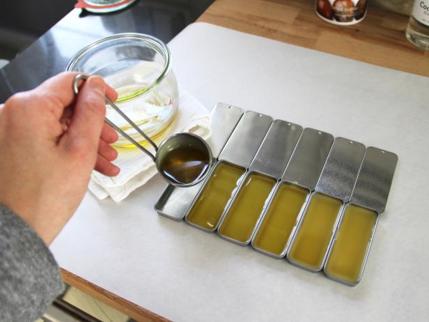 Pour Warm DIY Hard Lotion Ingredients Into Tins Pour Warm DIY Hard Lotion Ingredients Into Tins