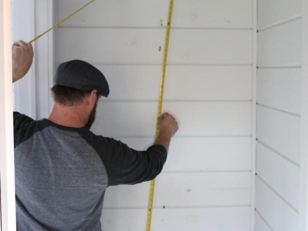 In order to fill the wall space with a properly proportioned pattern, measure the height and width using a measuring tape.