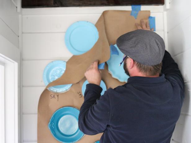 Undo the taped corners of the template and take it down from the wall.