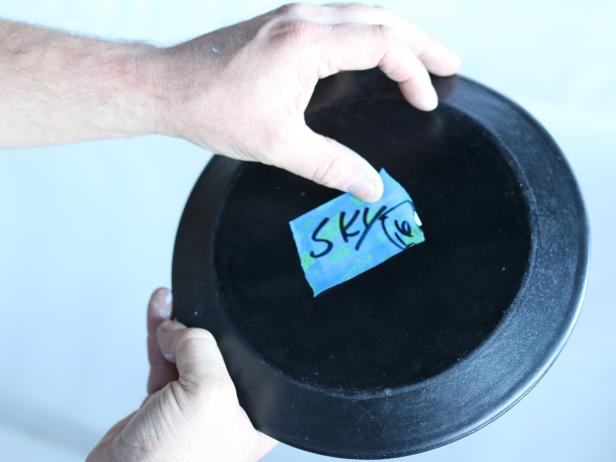 Reposition the numbered painterâs tape to the back of each plate. Youâll refer to this number when itâs time to place each of the plates on the wall.