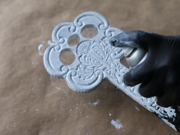 Carved wooden surfaces require different whitewashing than others. Instead of brushing on the mixed solution, spray the surface of the carved wood with flat white spray paint. This will fully fill the deep crevices of the carvings.