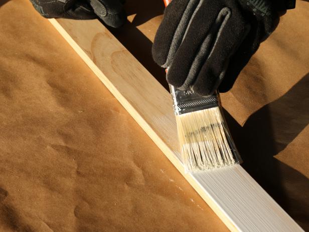 Paint the trim in an accent color (white and black work best) using 2-inch paint brush.