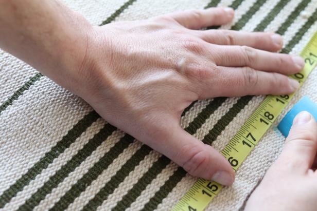 Using the length and width measurements of the pet bed as a guide, mark the rug to size using a marker or chalk.
