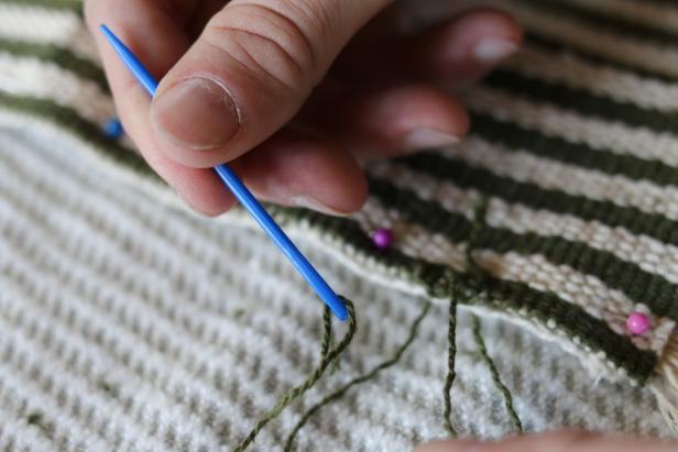 Thread round-ended tapestry needle with mercerized cotton then sew the four side panels to the top panel.