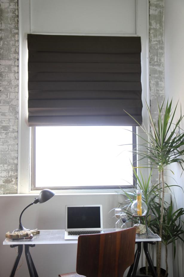 A roman shade offers both style and privacy.