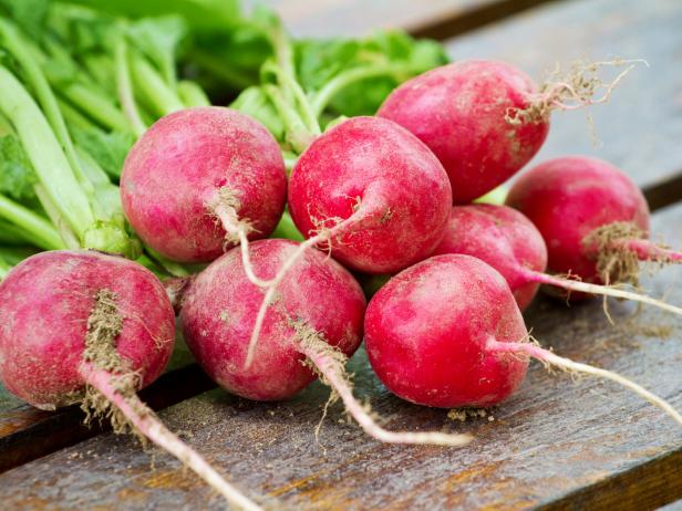 Fresh radishes on a wooden board Fresh radishes on a wooden board