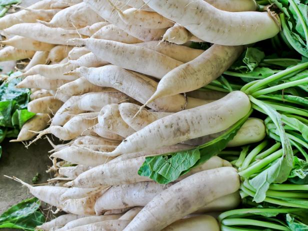 Daikon radish for sale in market. Daikon radish for sale in market.