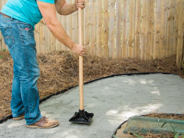 Step 5- Add Sand & Tamp DownWith the weed block material in place, spread a few inches of sand out, making sure to keep it somewhat level. For better drainage, try to make the middle of the pathway a bit higher than the sides for better run off. Tamp sand down for compaction.