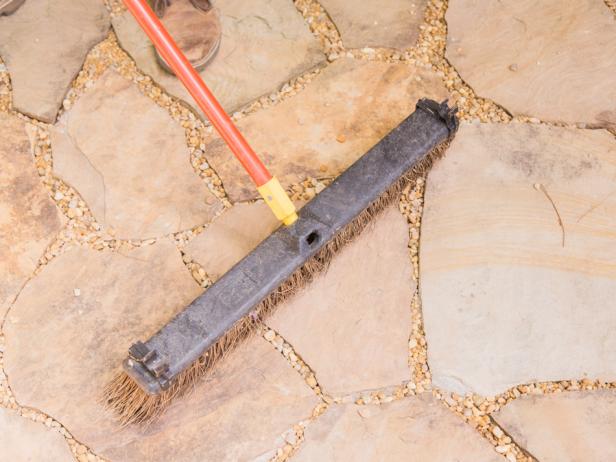 Step 7- Add PebblesOnce all the flagstone is in place, spread the pebbles out and sweep into the gaps with a wide broom. This will provide a unique texture, better water absorption and help keep the stones tight over time. Enjoy!