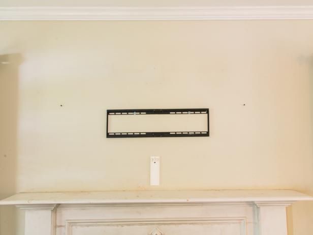 Step 1- Have a PlanSketch out the area you’re adding trim to so you can determine the linear feet you’ll need for the project. Remember you’re creating a grid on the wall AND capping off the channels, as well. Our project required 13 pieces of 12ft primed 1.5 inch thick lattice strips. Spending a bit more for primed strips was worth it and helped speed up the painting process considerably, later on. Remove the existing TV but leave the mounting bracket.