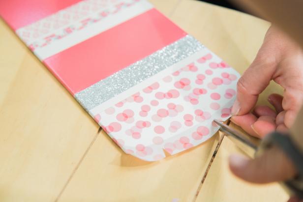 Step 3- Add Decorative TapeCraft stores sell a variety of decorative and washi tape in coordinating sets so even if you don’t have an “eye” for mixing and matching patterns, it’s easy to find a good looking combination packaged together. Place first piece of tape across the blade, aligning the edges of the tape where the painters tape was previously- this will help hide any imperfections if the paint line isn’t super crisp. Don’t get too heavy handed with the tape, as too much additional weight on the blades can throw the fan out of balance. PRO TIP- Washi tape, in particular, will look bolder with a WHITE background, so keep that in mind.