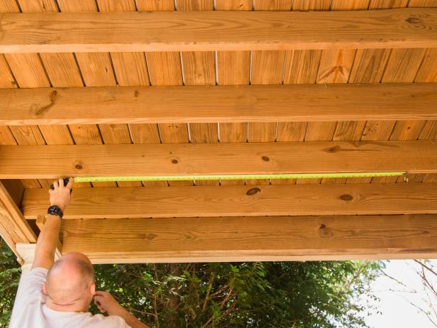 Step 2- Prep for Eye Bolts Pull your measuring tape across the middle of the swing to get an average width then make two marks that many inches apart along the joist with a pencil . Drill pilot holes using a drill bit thinner than the thickness of your eyebolt in preparation for installation PRO TIP- Never use a drill bit as thick as your eye bolt, as it will render the swing UNSAFE.